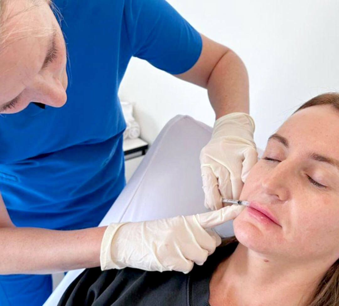 A woman receiving dermal lip fillers at Dr Katey Cosmetics in Healesville.